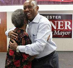 Sylvester Turner hugs a fellow supporter