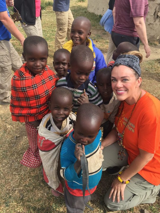Assistant Principal Alicia Eichhorn poses with children in Kenya over the summer.