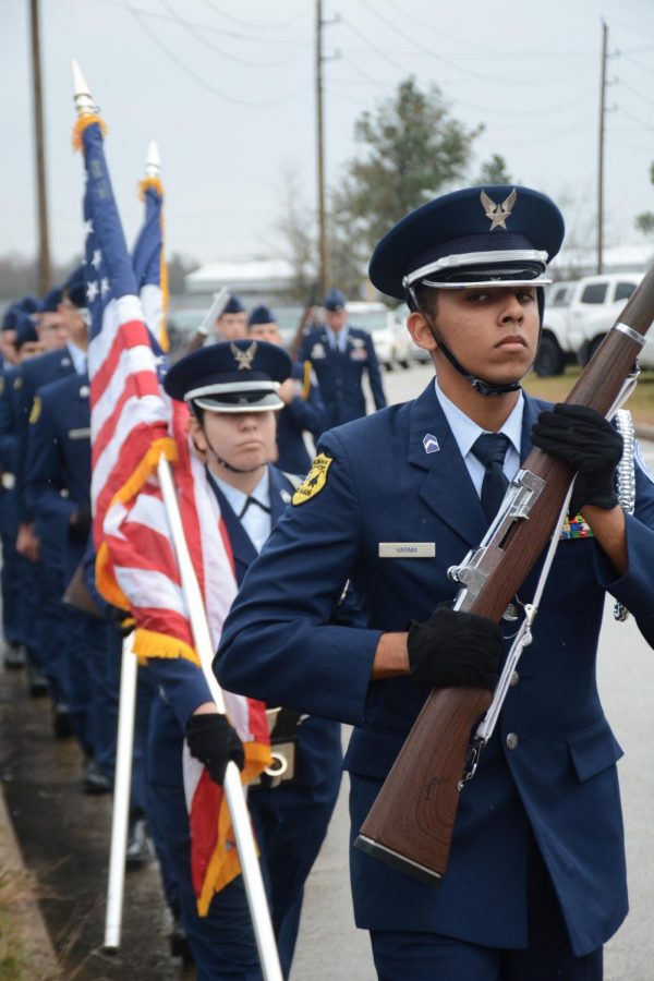 Members of Klein Oaks Airforce JROTC participate in the train procession Dec 6. The special train carrying the casket of Former President George HW Bush traveled by Klein Oak on its way to College Station. 