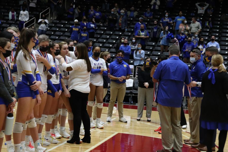 Members of the varsity volleyball team receive their silver medal at the 6A UIL State Championship game in Garland on Dec 12.