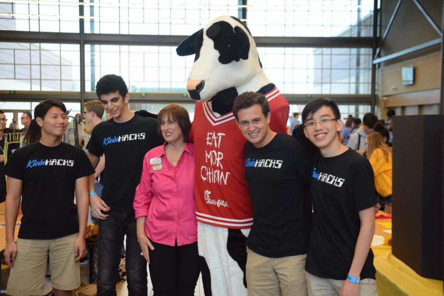 Klein Hacks pose with the Chick-Fil-A cow at Community Night in 2019. 