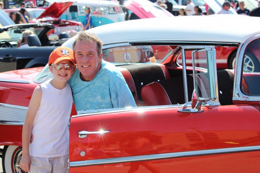 Father and son smile for the camera at Klein Band Car Show.