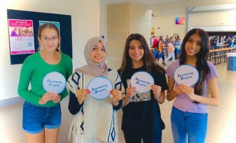 Marissa Coveler, Aysha Ameerah, Sophia Ayala, and Nidhi Patel representing their student-run global organization, Awareness Raisers.