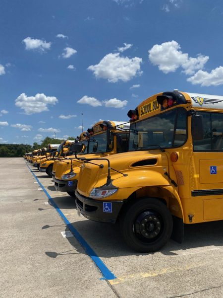 The Klein ISD Buses wait in the Transportation Lot.