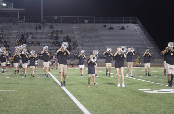 Band performs at first football game.
