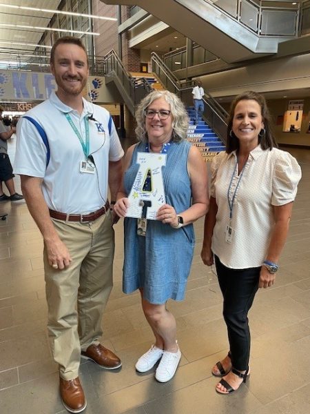 Assistant Principal Jacob Rice, Texas Bridge teacher Kayla Trainer, and College and Career Counselor Gayla Zamora standing with the CCMR A.