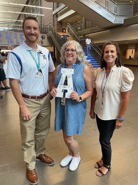 Assistant Principal Jacob Rice, Texas Bridge teacher Kayla Trainer, and College and Career Counselor Gayla Zamora standing with the CCMR A.