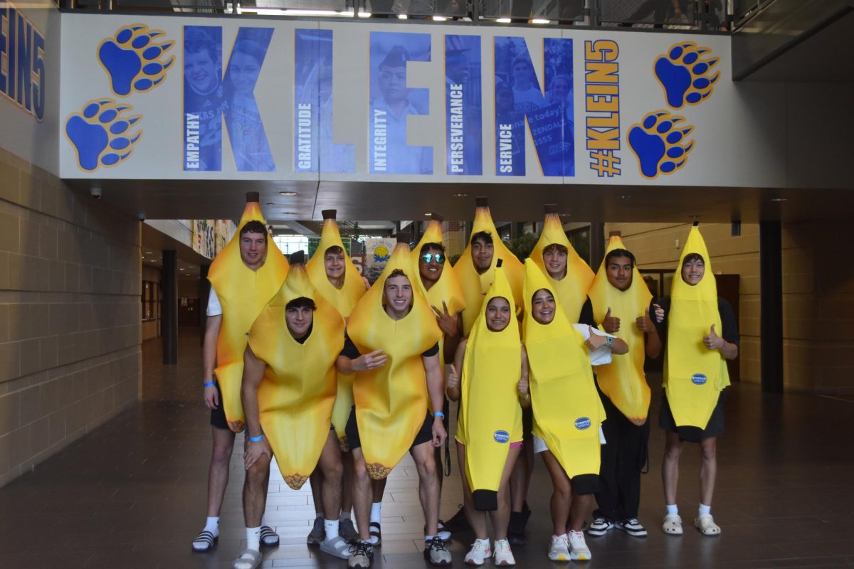 A group of friends dress in banana costumes for squad day.